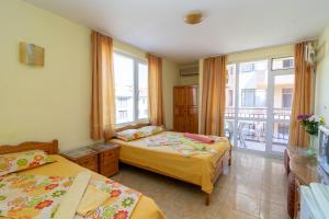 A bed or beds in a room at Fener Guest House