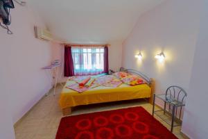 A bed or beds in a room at Fener Guest House