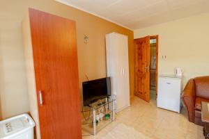 A television and/or entertainment centre at Fener Guest House