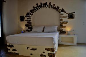 A bed or beds in a room at Pambelos Lodge