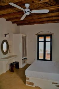A bed or beds in a room at Pambelos Lodge