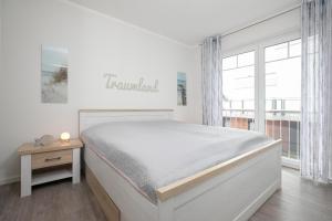 Llit o llits en una habitació de Blankwasserweg 11 Traumland