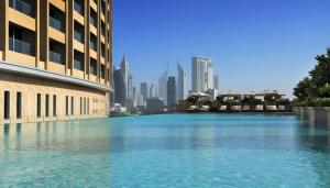 a large body of water in front of a city at Fashion Avenue Dubai Mall Residences - Studio with balcony in Dubai