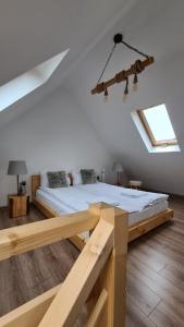 a bedroom with a bed in the attic at Apart Orkana 10D Zakopane in Zakopane