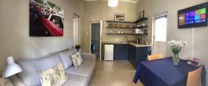 a living room with a couch and a table at Westway Corner in Montagu