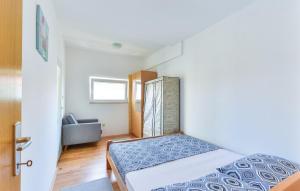 Postel nebo postele na pokoji v ubytování Apartmani Vugec, Povljana - Pag