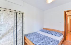 Postel nebo postele na pokoji v ubytování Apartmani Vugec, Povljana - Pag