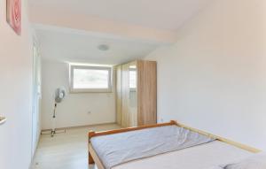 Postel nebo postele na pokoji v ubytování Apartmani Vugec, Povljana - Pag