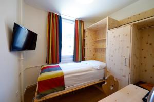TV a/nebo společenská místnost v ubytování Hotel Waldhaus am See