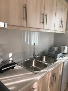 A kitchen or kitchenette at Banos Apartments and swimming pool