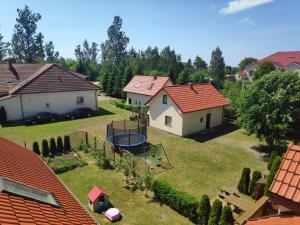 an aerial view of a backyard with houses at Villa Lavenda in Grzybowo