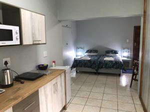 Kuchyň nebo kuchyňský kout v ubytování Blooming Nice Stay