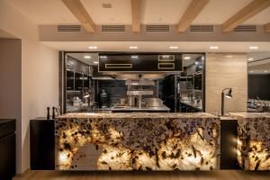 a kitchen with a counter top in a room at The Tanneries Hotel & Spa - a Member of Design Hotels in Chania