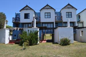 a large white building with a lot of windows at Balcones del Cabito in La Paloma