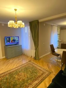 Un televizor și/sau centru de divertisment la Casa Ayan