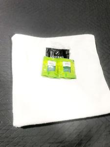 a white napkin with a battery on top of it at Quarto - Condomínio in Macapá