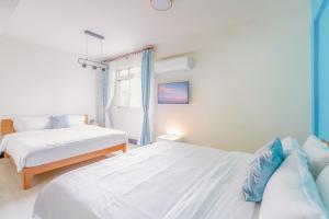 Een bed of bedden in een kamer bij 林居民宿