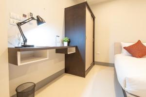 J2 Residence Chiang Rai客房内的一张或多张床位