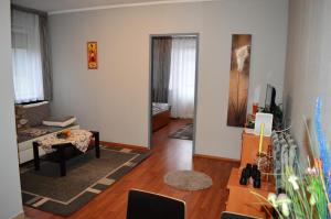 a living room with a couch and a table at Chill Hill in Egerszalók