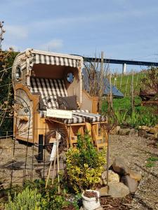 a play house is sitting in a garden at Ferienhaus Stülb in Zeltingen-Rachtig