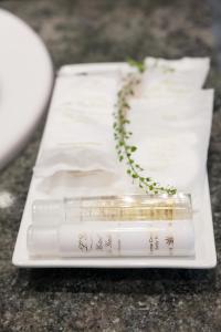 a white tray with two candles on a table at La Galería in Donostia-San Sebastián