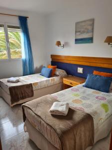 Postel nebo postele na pokoji v ubytování Villa Majorera