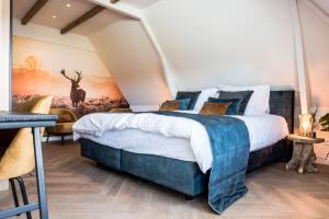 Кровать или кровати в номере de Vogelensangh