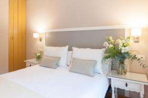 Postel nebo postele na pokoji v ubytování Hotel Monte Ulia