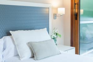 Postel nebo postele na pokoji v ubytování Hotel Monte Ulia