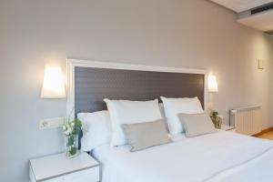 Postel nebo postele na pokoji v ubytování Hotel Monte Ulia
