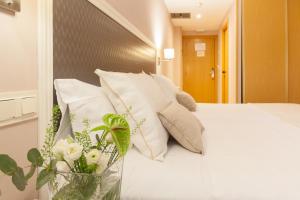 Postel nebo postele na pokoji v ubytování Hotel Monte Ulia
