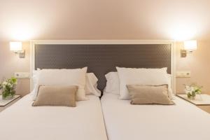 Postel nebo postele na pokoji v ubytování Hotel Monte Ulia