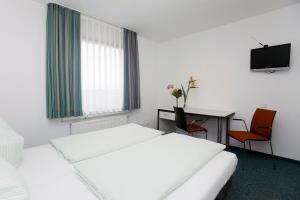 Säng eller sängar i ett rum på Jugendherberge Köln-Deutz