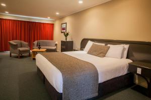 Postel nebo postele na pokoji v ubytování Cornwall Motor Lodge
