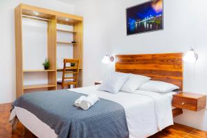 Voodi või voodid majutusasutuse Hotel Boutique Platanal toas