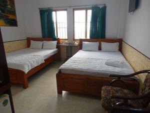 Postel nebo postele na pokoji v ubytování Thuong Hai Hotel