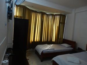 Postel nebo postele na pokoji v ubytování Thuong Hai Hotel