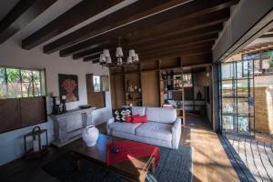 a living room with a couch and a table at Hotel Casa Santo Origen in Oaxaca City