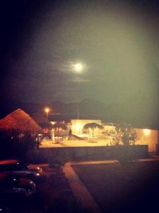 a view of a parking lot at night with a moon at Catorce Capital A una HORA de Real de Catorce in Estación Catorce