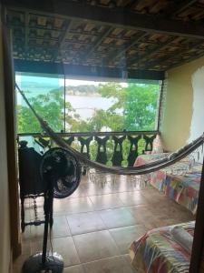 a room with a view of a balcony with a window at PACHAMAMA in Rio de Janeiro