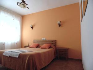 Postel nebo postele na pokoji v ubytování Hostal Río Mundo