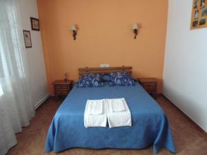 Postel nebo postele na pokoji v ubytování Hostal Río Mundo