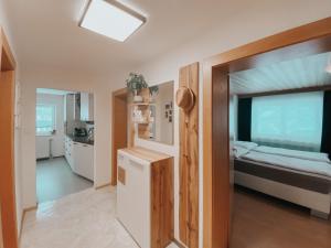 a room with a bed and a refrigerator in it at Apartment Lina in Achenkirch