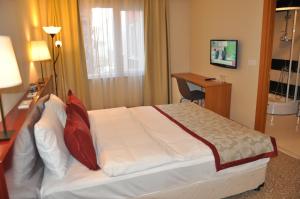 Postel nebo postele na pokoji v ubytování Trakya City Hotel
