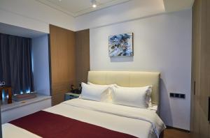 Postel nebo postele na pokoji v ubytování Kezan Condo Hotel + 28 fotografií