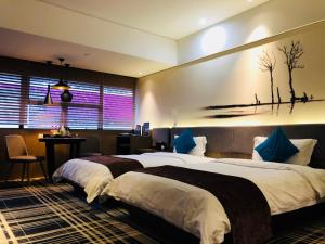 Postel nebo postele na pokoji v ubytování Likto Hotel-Free Shuttle Bus to Canton Fair