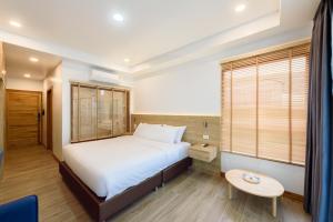Chiangkhan River Walk Hotel客房内的一张或多张床位