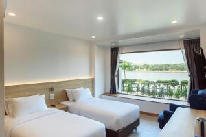 Chiangkhan River Walk Hotel客房内的一张或多张床位