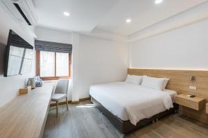 Chiangkhan River Walk Hotel客房内的一张或多张床位