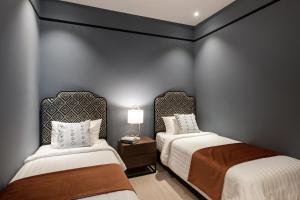 Postel nebo postele na pokoji v ubytování AMI Suites - Arte Mont Kiara